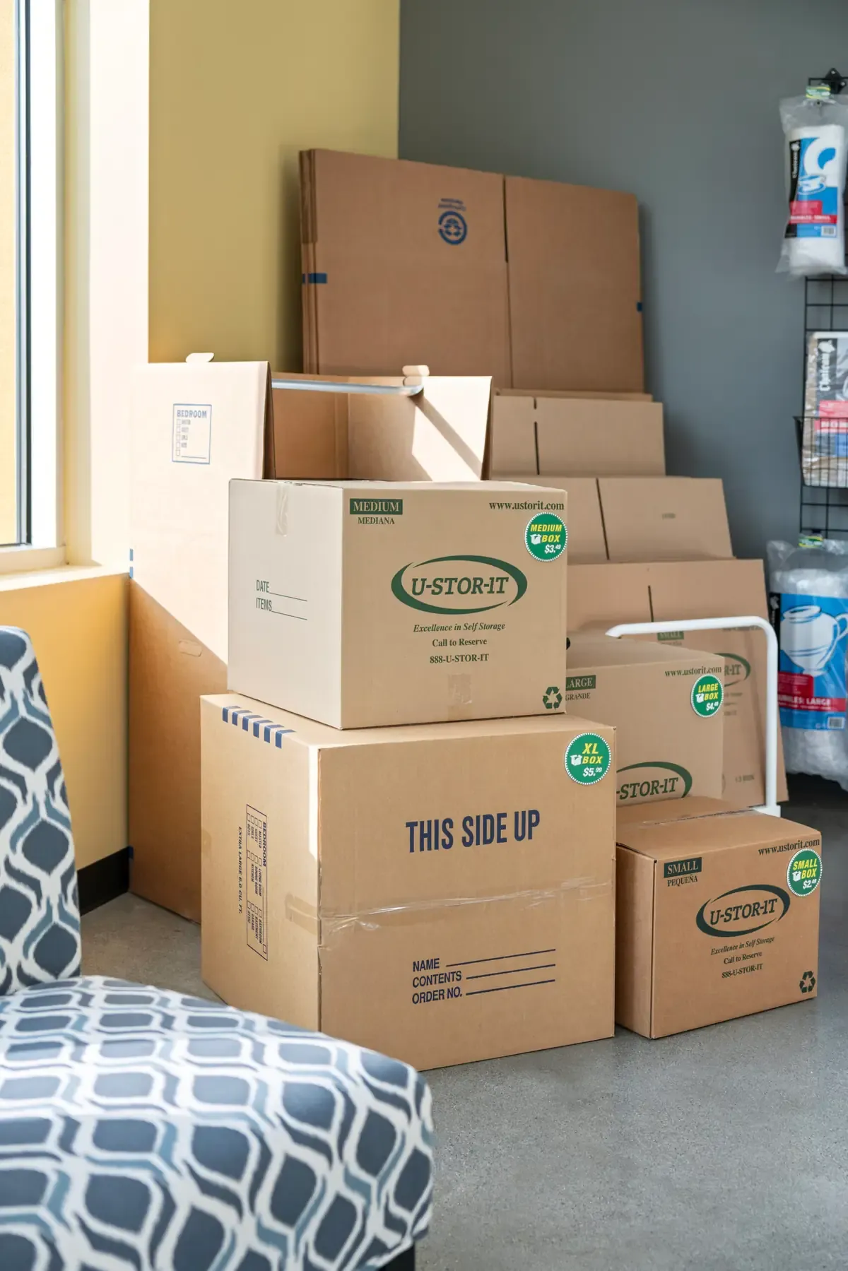 Neatly organized storage unit with boxes and household items at U-Stor-It.