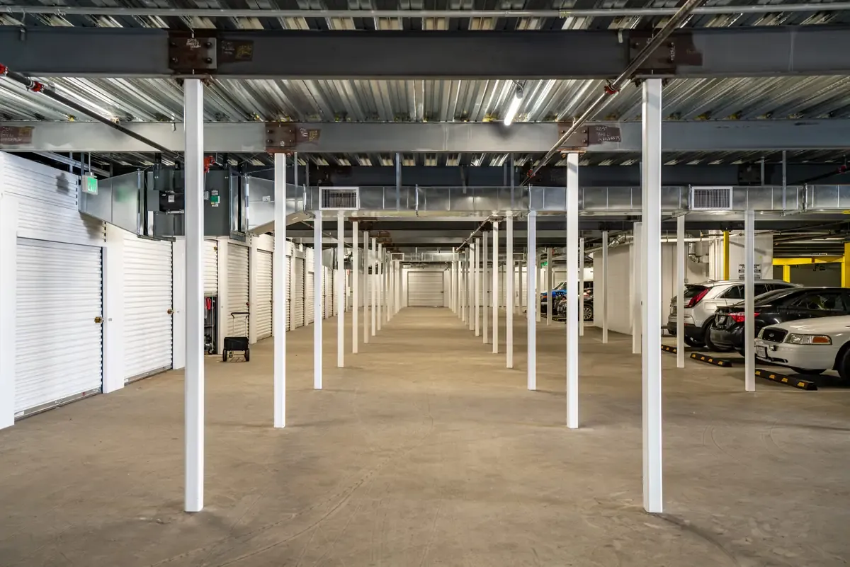 Interior of self storage facility, view of elevator and parking lot.